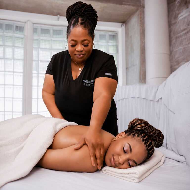 Woman receiving back massage